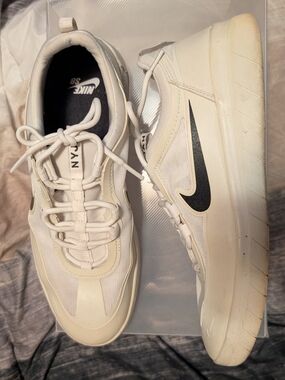 Nike Men’s White Sneakers with Black Swoosh